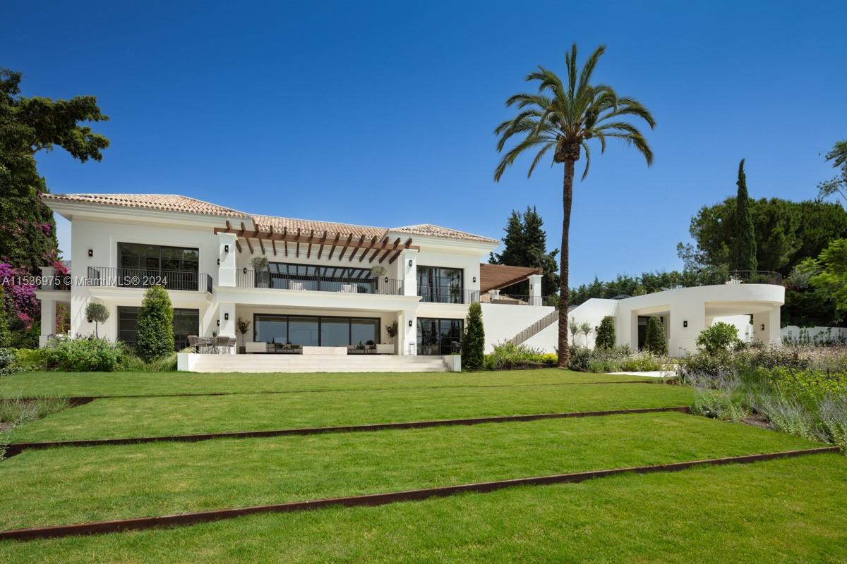 Property is located in Marbella, Spain. Villa Alpine: Palatial estate in Rocío de Nagüeles with vast living spaces, mountain and sea views, and sprawling gardens. Gourmet kitchen by Danespan, heated saltwater pool, outdoor kitchenette, and private courts. 7 bedrooms, including luxurious master suite with terrace. Features wellness spa, wine room, entertainment area, gym, and guest apartment. Epitome of Marbella luxury living with proximity to La Concha mountain, emblematic of Mediterranean architecture. This residence embodies sophistication, offering breathtaking vistas, prime location, unrivaled elegance, and the pinnacle of opulent living.