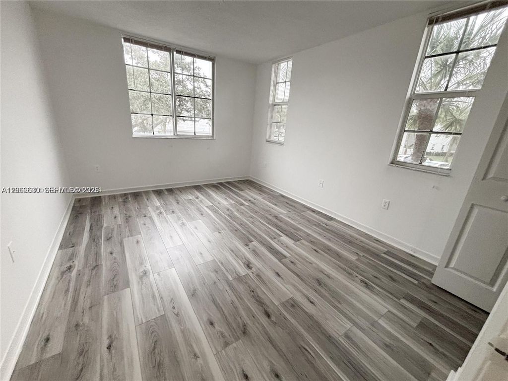 Photo of 655 SW 111th Way #201, Pembroke Pines, FL 33025 (MLS # A12012630)
