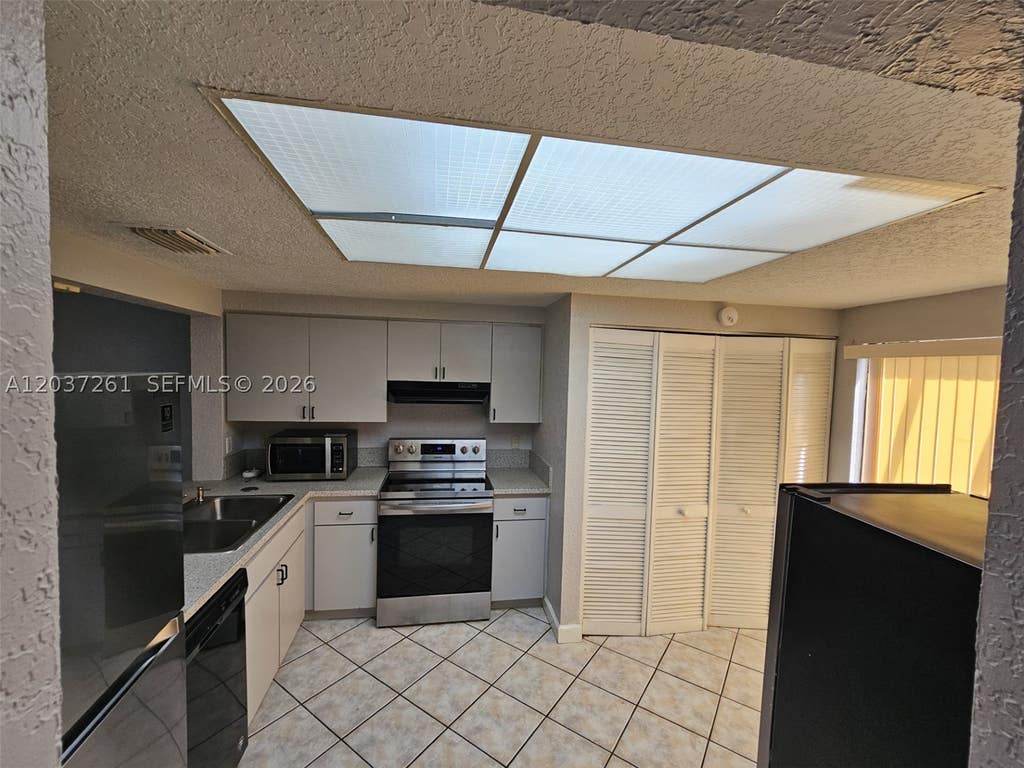 Photo of 8837 NW 48th St #., Sunrise, FL 33351 (MLS # A12037261)