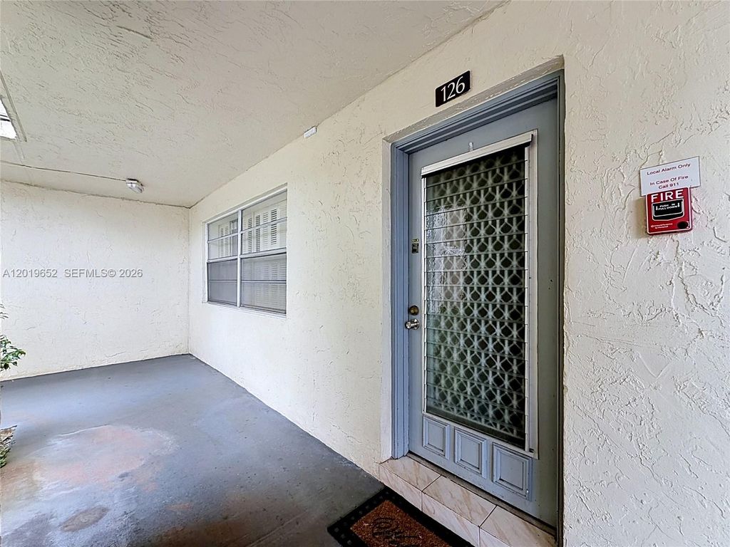 Photo of 3000 NW 48th Ter #126, Lauderdale Lakes, FL 33313 (MLS # A12019652)