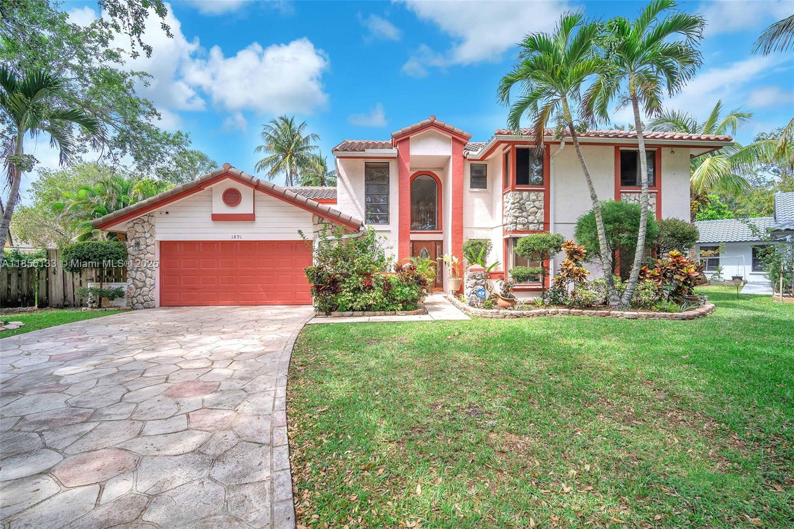 The largest waterfront & pool home in Fox Run at Jacaranda!! 5 large bedrooms & 3.5 bathrooms with 2,950 sqft under air, 2-car garage, beautiful pool & patio all situated on .32 of an acre with peaceful water views & privacy. Spacious floorplan with volume vaulted ceilings in living areas, kitchen w/granite countertops, wood cabinetry & S.S appliances. Private laundry room w/laundry tub. The primary bedroom & bathroom, guest bedroom & bathroom, and ½ bathroom are on 1st floor, the other 3 bedrooms & updated bathroom are upstairs. Enjoy your huge backyard w/fruit trees & beautiful large pool! A nice size lanai and convenient cabana bath awaits you for all your relaxation and entertaining days. Newer AC, water heater & tile roof is 10 years old. This home has so much more to offer. MUST SEE!