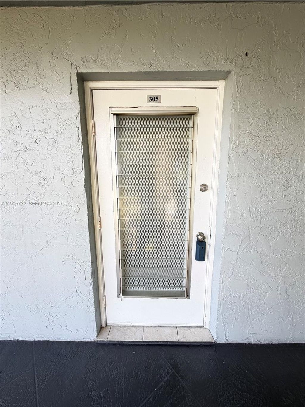 Photo of 9201 Lime Bay Blvd #305, Tamarac, FL 33321 (MLS # A11995722)