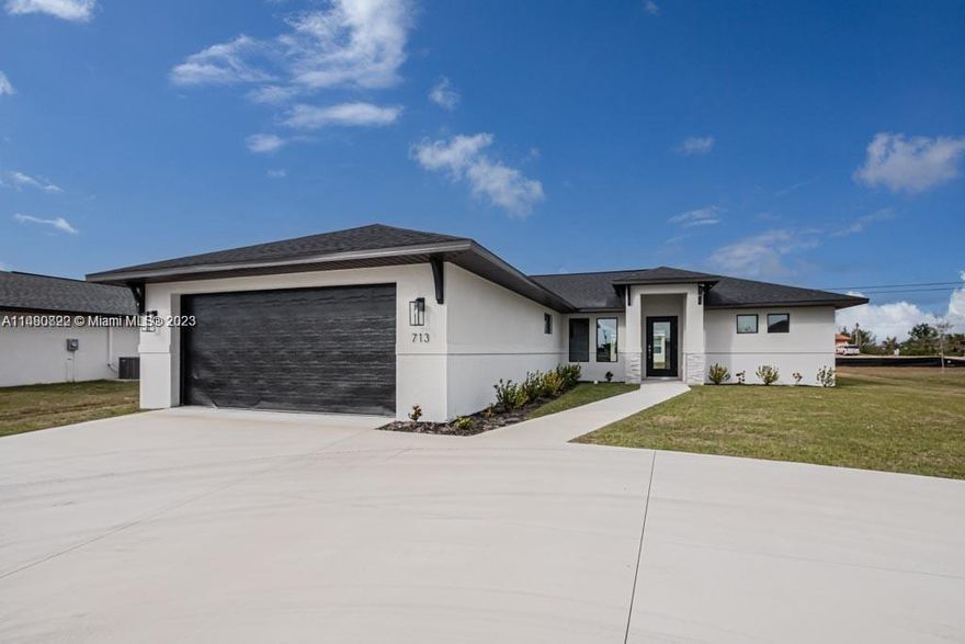 NEW Construction READY TO MOVE IN. Beautiful Single Family Home in Cape Coral with a Certificate of Occupancy from the City. Cape Coral is one of the fastest-growing areas in the country. 4 beds, 2 baths, 2 car garage, with a circular driveway. Beautiful kitchen with granite countertops, stainless steel appliances & real wood soft close cabinets. Open living room with vaulted ceilings. Tile floors throughout the house. Sewer & City Water. Big lot with space for a pool. Laundry room inside the house. No Association. Pets welcome. Easy to show at any time.