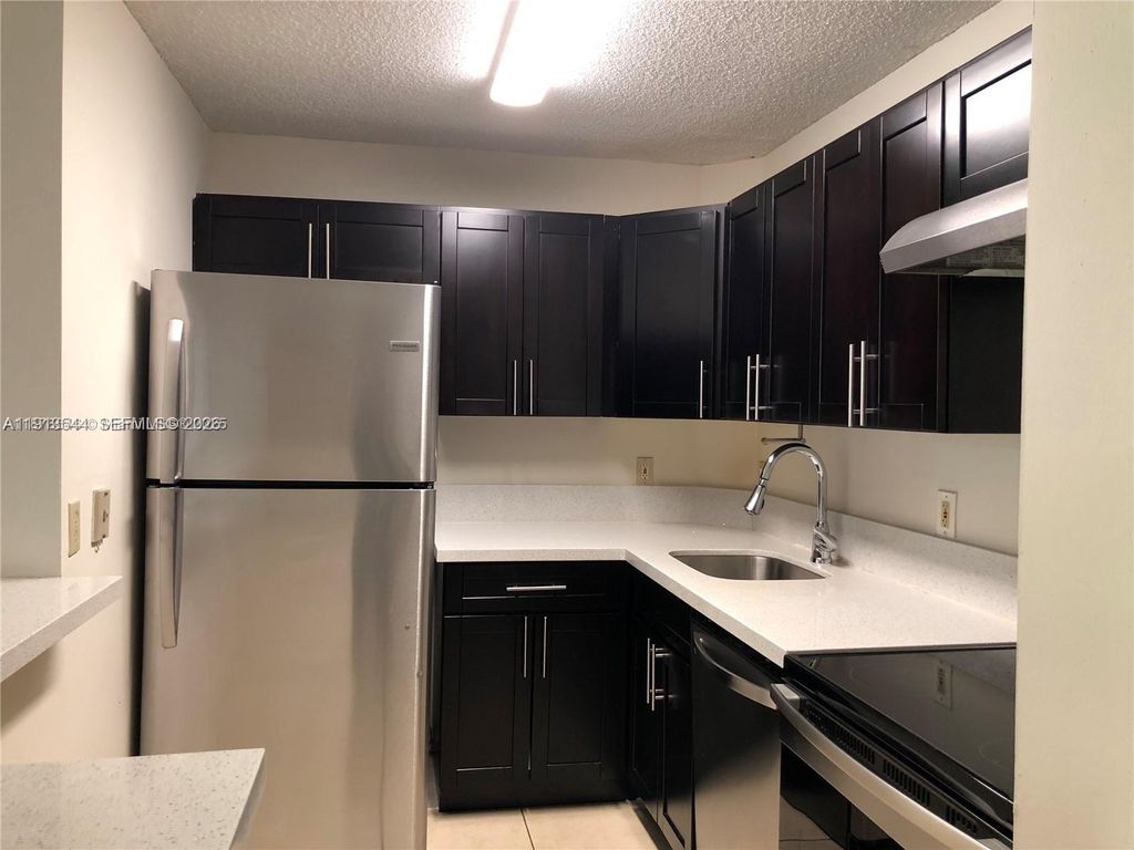Photo of 10757 Cleary Blvd #104, Plantation, FL 33324 (MLS # A11913544)