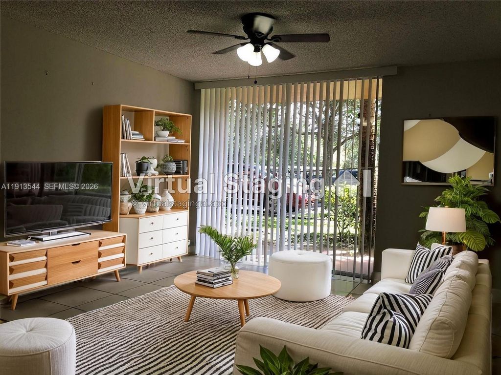 Photo of 10757 Cleary Blvd #104, Plantation, FL 33324 (MLS # A11913544)