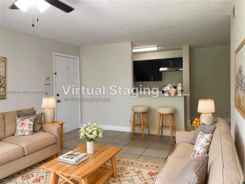 Photo of 10757 Cleary Blvd #104, Plantation, FL 33324 (MLS # A11913544)
