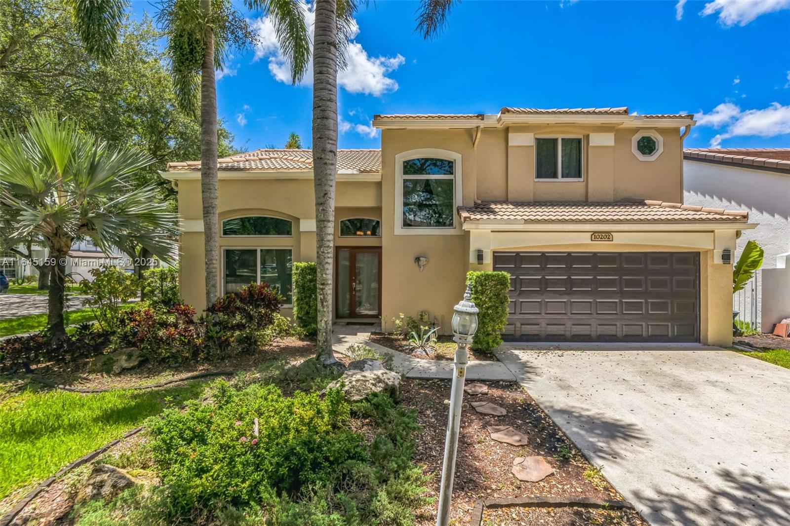 PRICE IMPROVEMENT!! Beautifully updated home in Embassy Lakes. Warm and inviting with high ceilings and rich wood plank floors. Large kitchen with Shaker style cabinets and granite counters. The island is perfect for food prep and casual dining. The lovely master bedroom suite is on the first floor. The other two spacious bedrooms are upstairs and connected via a Jack & Jill bath. The AC was recently replaced and has a smart thermostat. There are impact windows throughout. The patio is a private retreat with low/no yard maintenance. Embassy Lakes is the perfect community to call home with amenities like pool, gym, tennis and basketball courts.