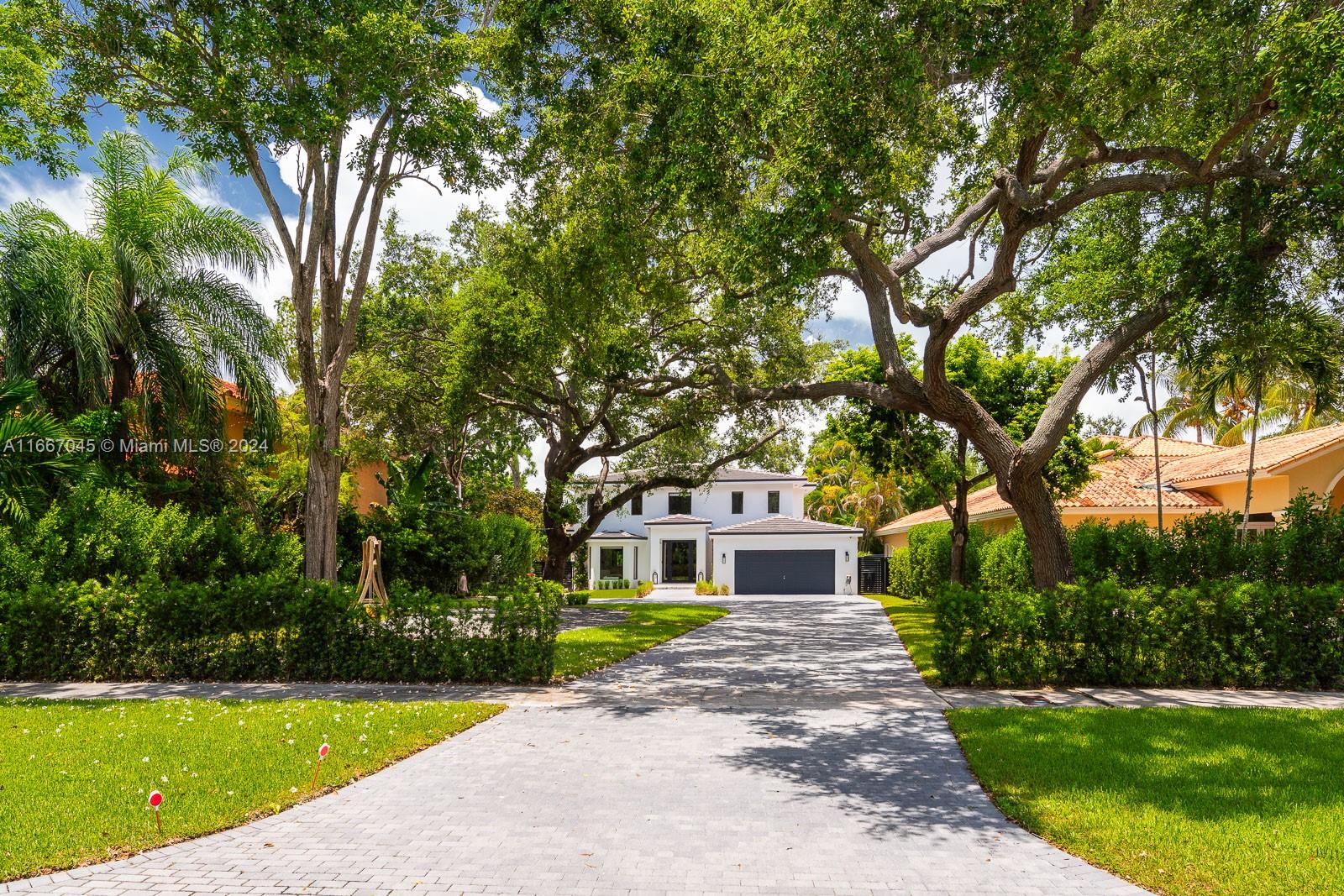 Beautifully Updated Home in South Miami with long driveway with mature oaks. This 4 bedroom 4 bathroom with den/office has been recently updated from the inside out. Brand new roofing, impact windows, European White Oak flooring, Natural Marbles, kitchen, appliances, and more more more. This inviting open floor plan lets a great amount of light into the house giving you the feeling of being immersed in the surrounding trees and amazing backyard space. The backyard includes new coral stone pavers, low maintenance turf and refinished pool. 1 lot over you have a brand new neighborhood park where the nearby families love to gather after school and work. option to purchase fully furnished.