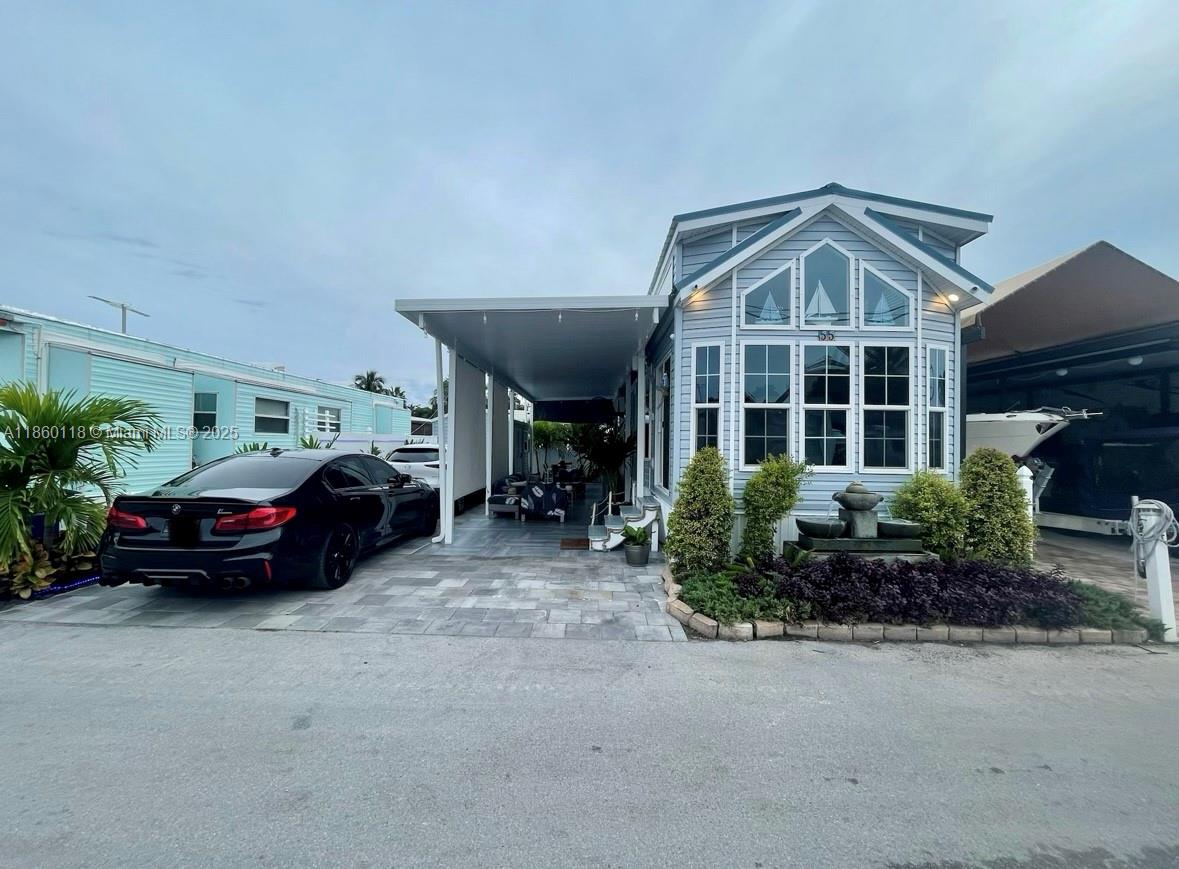 Turn Key AirBnB Investment property with rentals from 1 to 365 days or your own personal getaway in beautiful Key Largo. Park your boat in your own paved and tiled driveway and launch it in the community boat ramp. Enjoy spending time under the aluminum pergola with drop down shades for added comfort and privacy, while you process and BBQ your catch from a day of fishing. Large Shed on the property to store all your equipment on the property. Once you step inside the 2018 RV the high ceilings and modern finishes is the place welcome you and you will feel right at home. With a Washer and Dryer in the property you will have all the comforts and conveniences you are looking for. The property can come furnished or unfurnished.