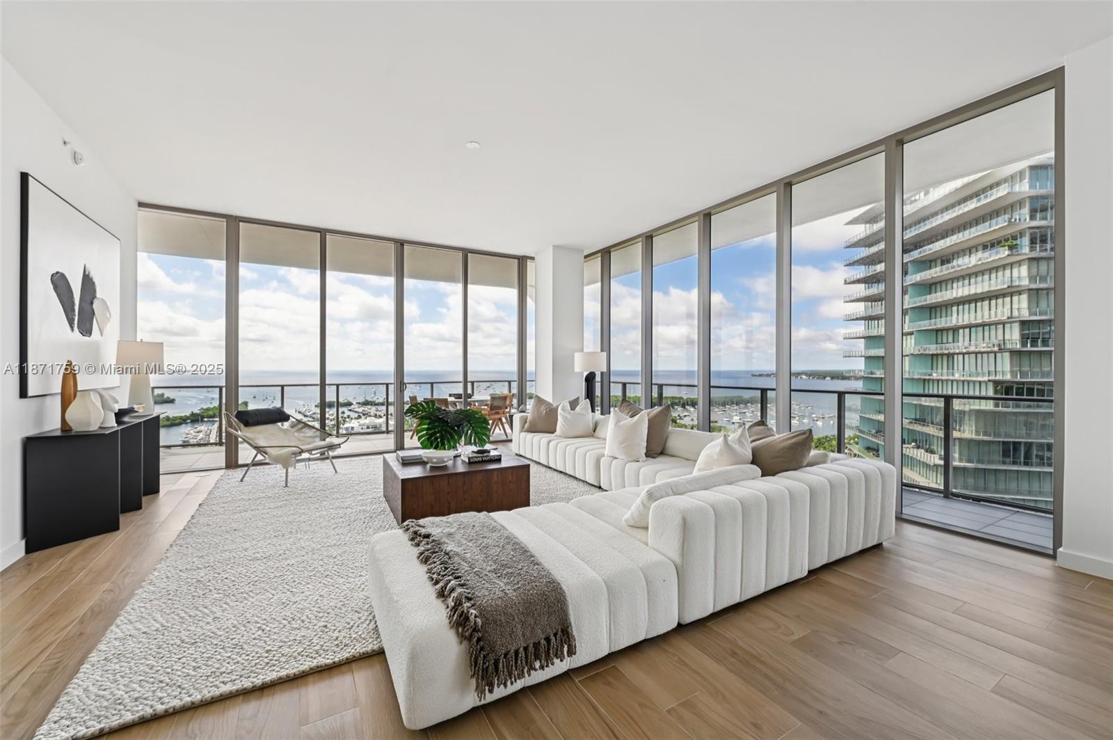 Experience exceptional living at Mr. C Residences in Coconut Grove. This stunning 4-bedroom, 3.5-bath residence features 2,715 sqFt square feet of beautifully designed space, highlighted by an expansive 815-square-foot wraparound terrace with breathtaking views from Peacock Park to Key Biscayne. Upon entering, you're welcomed by 11-foot floor-to-ceiling windows that flood the interior with natural light. The home boasts high-quality finishes, including elegant Italian terrazzo, sleek quartz countertops, and warm European porcelain tile flooring. Solid core wood doors add classic charm, showcasing the meticulous craftsmanship throughout.Additionally, a storage space is assigned to this residence for your convenience. Enjoy personalized services, 24-hour concierge, and world-class amenities.