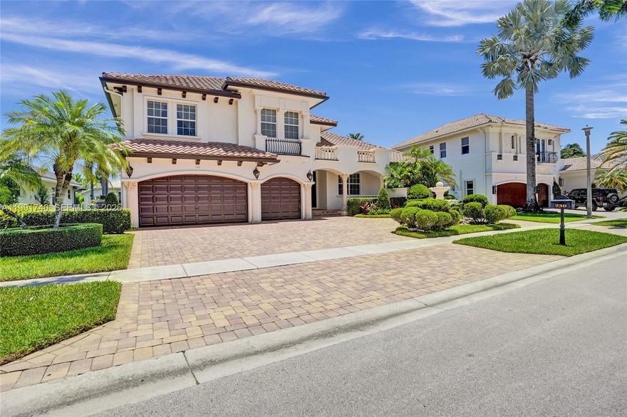 Experience modern luxury in this stunning waterfront home in the exclusive guard-gated community of Hawks Landing. This 2-story residence offers 5 bedrooms, 4.5 bathrooms, and a 3-car garage with over 3,800 sq ft on a 10,510 sq ft lot with breathtaking lake views. Step inside to soaring 20-ft ceilings and dramatic floor-to-ceiling glass walls that flood the home with natural light. Elegant Italian marble floors and staircase have been recently refinished, adding timeless sophistication throughout. The gourmet kitchen features high-end appliances including a 6-burner gas cooktop, double ovens, wine cooler, ice maker, warming drawer, and a spacious walk-in pantry, perfect for entertaining. The first floor includes an office/5th bedroom, offering flexibility for work or guests, and a spacious primary suite with direct pool access, tray ceilings, dual walk-in closets, and a spa-like bath. Upstairs offers 3 bedrooms, a loft, and 2 full baths. Enjoy outdoor living with a summer kitchen, infinity pool, and heated spa overlooking the lake, ideal for relaxing or hosting guests. Upgrades include impact glass, new A/C, epoxy garage floor, and 2025 updates: interior/exterior paint, washer/dryer, and diamond brite pool. Resort-style amenities include an Olympic-size pool, pickleball and tennis complex, fitness center and spa, basketball courts, and a recently renovated clubhouse, offering a true country club lifestyle with the perfect blend of luxury, elegance, and active living.