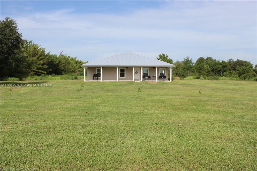 Enjoy peaceful country living in this beautifully crafted 3-bedroom, 2-bath home nestled on a spacious 5-acre lot. Built in 2023, this modern home offers comfort, style, and privacy. Start your mornings on the large front porch with a cup of coffee, soaking in the serene views and sounds of nature. Inside, you’ll find a bright, open floor plan with granite tops in kitchen and bathrooms. The home features a private well with a full water treatment system for your peace of mind. Nature lovers will appreciate the regular sightings of deer and turkeys that roam the property. Whether you’re looking for a quiet retreat or a place to enjoy the outdoors, this property has it all.