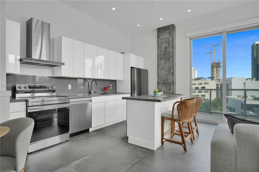 Unique Midtown Loft. Fully renovated 1,100 sq ft duplex corner loft. Industrial style, with exposed concrete features, stone tile floors, floor-to-ceiling windows, Lutron blinds, and over 600 sq ft of wraparound terraces on two floors. The unit has a modern kitchen with large island and brand new appliances, new bathrooms, a laundry room, same floor parking space, and space for storage, a home office or a dressing room. Offered furnished or unfurnished, this unique residence blends contemporary design with functionality, perfect for buyers seeking a turnkey urban lifestyle. Situated in a full-service building, residents enjoy premium amenities and a prime location with unmatched walkability to shops, restaurants, cafés, and just minutes from the Design District and Wynwood, as well the I95, so the beach is only 10 minutes away.