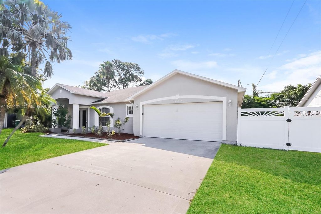 Photo of 2452 SE Sapelo Ave, Port Saint Lucie, FL 34952 (MLS # A11674272)