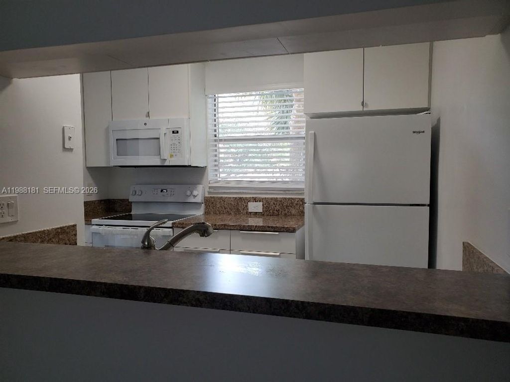 Photo of 3238 NW 102nd Ter #208-F, Coral Springs, FL 33065 (MLS # A11988181)