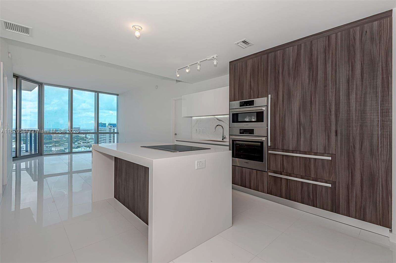 Luxury 2 Bed + Den /3 bath at the Miami World Center with European modern kitchens with top of the line appliances. 10 foot floor to ceiling windows with huge balcony. This building has the best amenities in the area: Basketball Half-Court, Racquetball Court, Relaxation Areas: Conservatory, Relaxation Lounge, Spa/Salon, Indoor Sports Center (State-of-the-art Fitness Center, Boxing Studio, and Aerobics Area), Entertainment Center. It is conveniently located next to I-95 and I-395. Can be rent 4 times a year. Seller financing available.