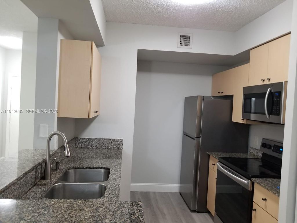 Photo of 2470 Centergate Dr #102, Miramar, FL 33025 (MLS # A11942663)
