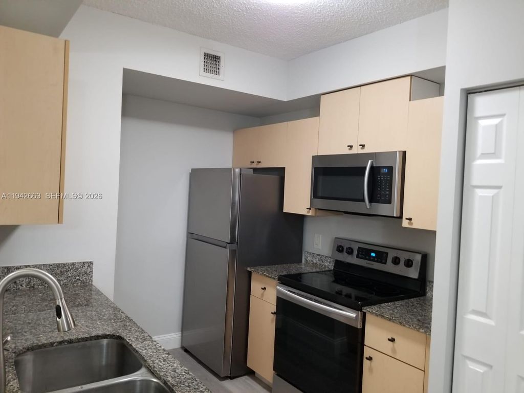 Photo of 2470 Centergate Dr #102, Miramar, FL 33025 (MLS # A11942663)