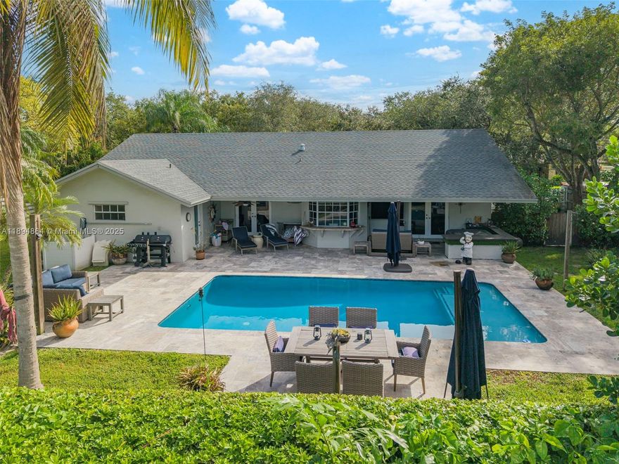 Welcome to Country Walk, one of Miami’s most desirable family communities. This spacious 4-bedroom, 2.5-bath single-story home sits on a 0.3-acre lot along a tree-lined street with hanging moss, offering peace and charm. High ceilings and large windows fill the home with natural light, creating an open, airy feel. Enjoy separate living and family rooms, a formal dining area, and a kitchen that flows outdoors—perfect for entertaining. The backyard retreat boasts mature fruit trees and a recently resurfaced 30-foot pool surrounded by lush landscaping. A two-car garage adds convenience, and impact windows are being installed for safety and efficiency. With space, style, and a prime location near top schools and parks, this Country Walk gem is priced to sell and won’t last!
