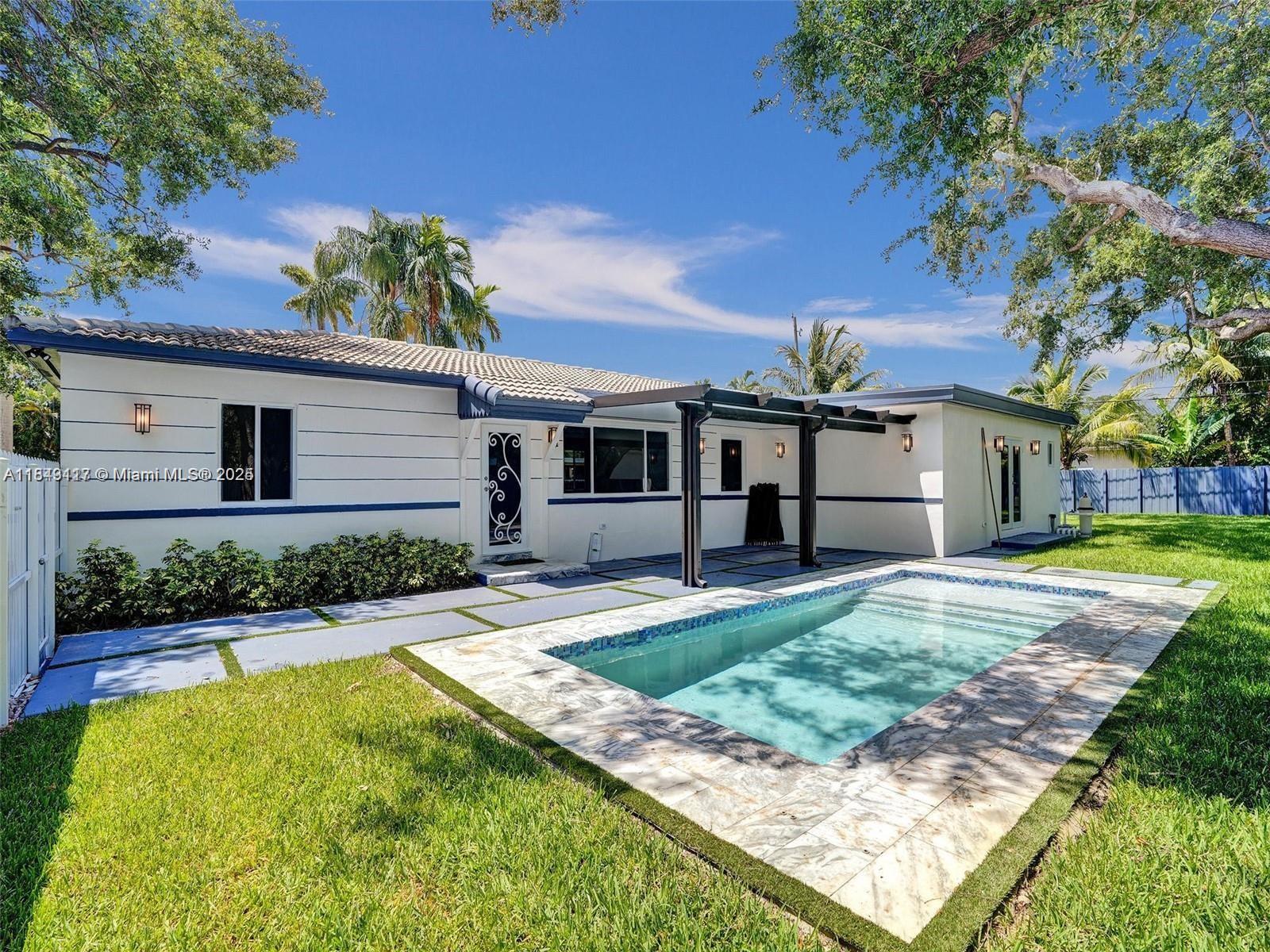 Stunning 5-bedroom, 3-bath single family home for rent in desirable Biscayne Park! This beautifully updated residence features an open-concept layout with modern porcelain floors throughout, a chef’s kitchen with stainless steel appliances, quartz countertops, and sleek cabinetry. Enjoy spa-inspired bathrooms with elegant finishes and a luxurious primary suite. The spacious backyard is perfect for entertaining, boasting a sparkling pool and ample green space. Located on a quiet street surrounded by lush greenery, this home offers style, comfort, and privacy—just minutes from shops, dining, and beaches. A rare rental opportunity that won’t last long!
