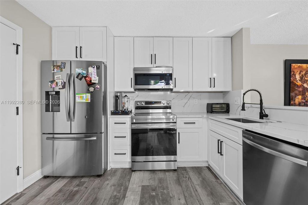 Photo of 10997 Long Boat Dr, Cooper City, FL 33026 (MLS # A11992280)