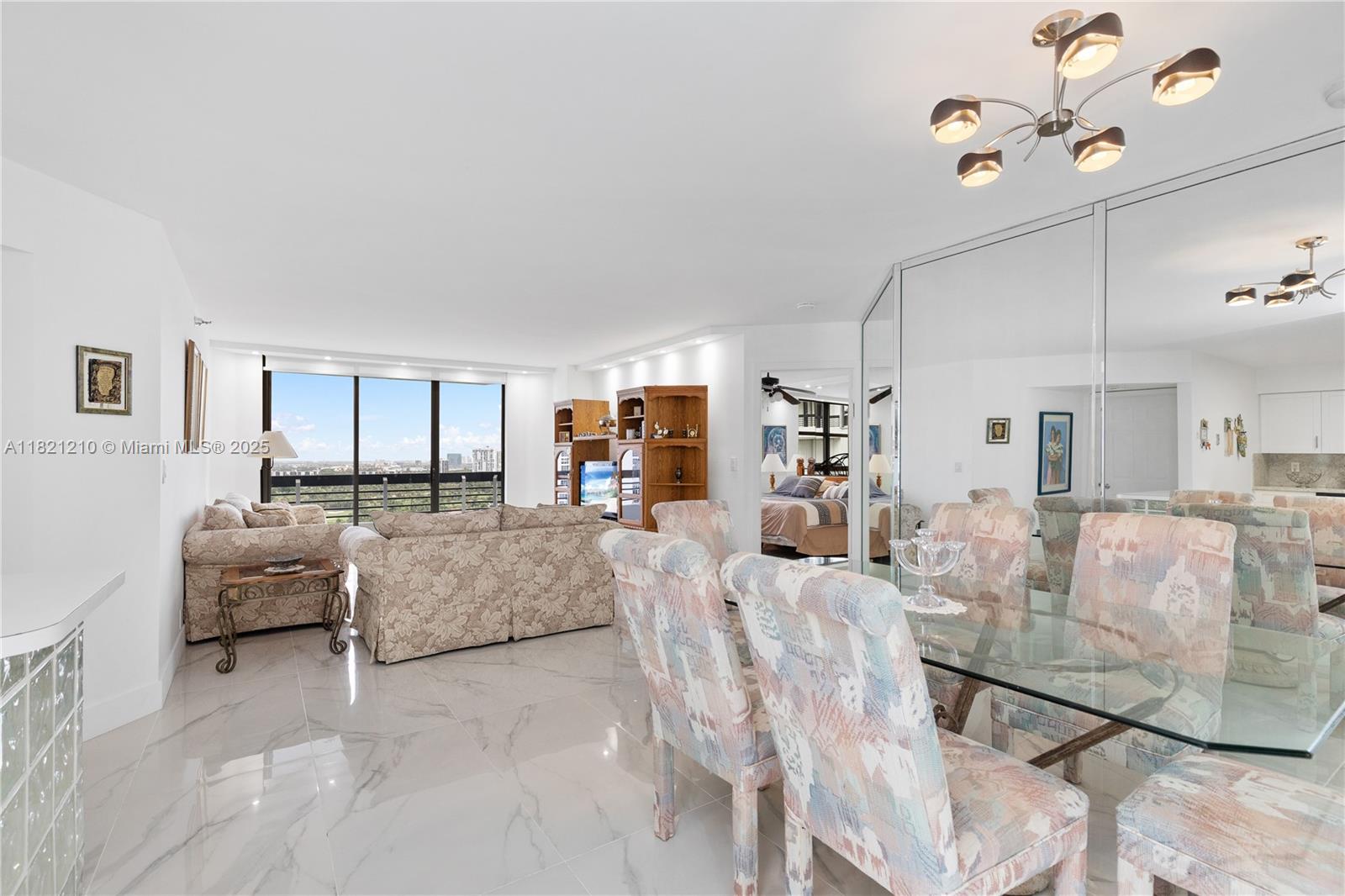 Welcome to your slice of paradise in Mystic Pointe! High-floor 2-bedroom, 2-bath residence offers the perfect blend of comfort, style, and location. Enjoy serene views of the canal, city skyline from every window and your private terrace—ideal for morning coffee or evening wine. Step inside to a renovated home featuring an open concept kitchen with bar counter, stainless steel appliances, updated bathrooms, spacious walk-in closets, stackable washer/dryer. The layout is smart and inviting for full-time living or a seasonal retreat. Enjoy resort-style amenities: upgraded gym, pool, sauna, tennis, pickleball, kids playground, marina, paths, cafe, and convenience store. Plus, 24/7 security, concierge, on-site management offer complete peace of mind.