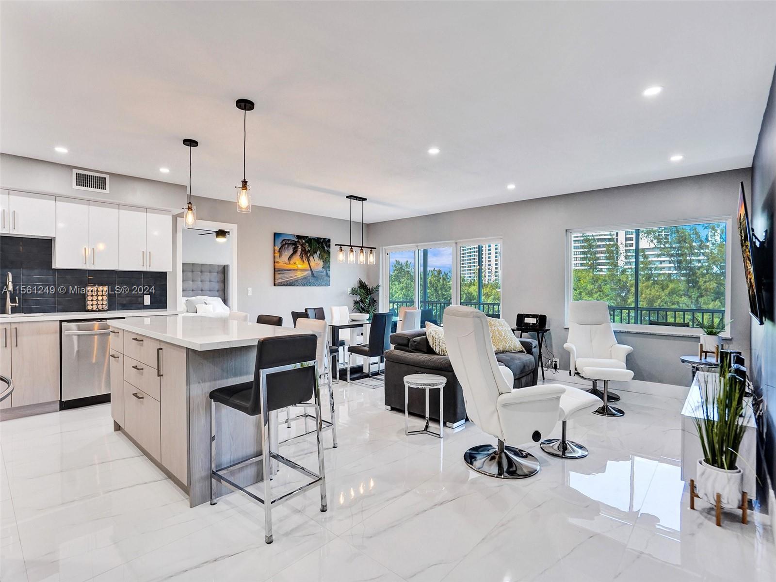 This beautiful condo located in the heart of Hallandale Beach, offers a prime location just steps away from the beach. Completely remodeled with a brand new open kitchen with two-tone cabinets, stainless steel appliances, and a wine refrigerator. This two bedrooms & two bathrooms features a split floor plan & will sell all furnished & turnkey. Beautiful porcelain shiny floors in living area, and impact windows throughout. Every detail exudes luxury. Don't miss out on the chance to wake up to breathtaking water views every day! New AC 2023 & new electrical panelThe waterfront community has 2 heated pool & a gym. Located near the beaches & nature parks. Walking distance to the stores & restaurants. Cable, wifI & hot water are included in the fees! Don't wait