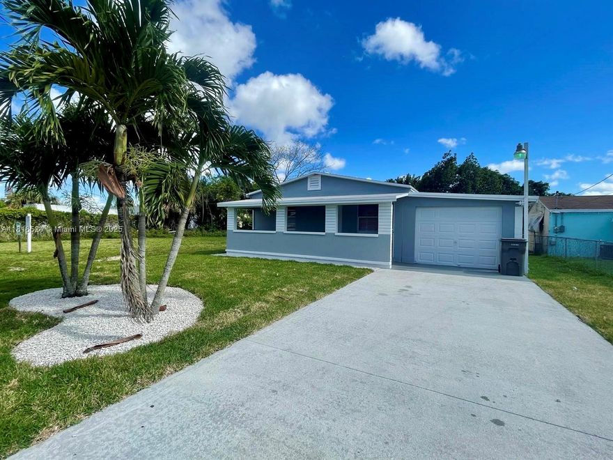 Welcome to this beautifully  single-family home, full of charm and modern upgrades — and best of all, NO HOA! Nestled on a generous lot with a  chain-link fence and gated backyard, this property offers privacy, space, and functionality. Relax on your brand-new screened-in patio, perfect for morning coffee or evening gatherings,Ideally located just 10–15 minutes from Downtown West Palm Beach. Easy to show — schedule your private tour today!