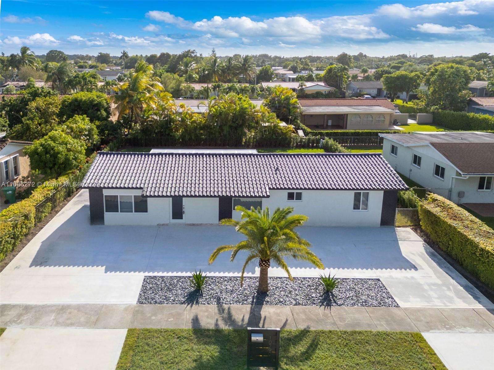 Welcome to this beautifully renovated 4-bedroom, 2-bathroom home, perfectly located in a highly sought-after neighborhood. Step inside to find stunning porcelain tile flooring throughout, complemented by sleek quartz countertops and stainless steel appliances in the modern kitchen. The spacious layout is ideal for both daily living and entertaining, with a large backyard that offers ample space for a future pool — your perfect canvas for creating an outdoor oasis. This home also features a sprinkler system and pump installed with a timer for easy lawn maintenance. Blending contemporary style with comfort, this home is a must-see! Don’t miss out on this incredible opportunity to own your own piece of paradise in a prime location!