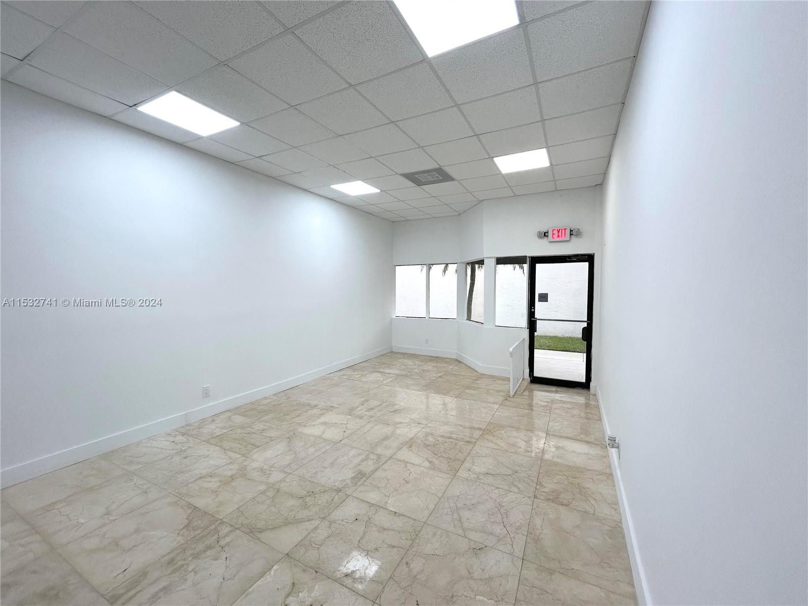 Incredible opportunity to either establish or expand a Business in one of the fastest growing cities in the country. Located in the Alhambra Business Center along busy 79th Ave, less than a mile to the Palmetto. Flex space unit consists of 625 sq ft under AC split between an office with 10ft ceilings and a warehouse space with 14ft ceilings and loading door. Ideal for Start-ups looking for a dynamic environment to grow, Professionals seeking a sophisticated location for client meetings or Entrepreneurs desiring a prime location for maximum visibility. Competitive lease terms tailored to suit business requirements. Call listing agent for more information or to schedule an appointment. No retail tenants. Base rent of $1,800 + tax
