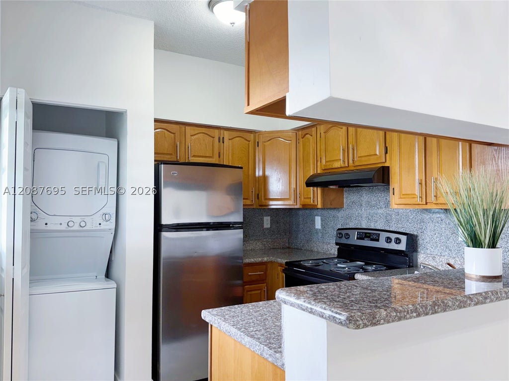 Photo of 2001 NW 96th Ter #10J, Pembroke Pines, FL 33024 (MLS # A12087695)