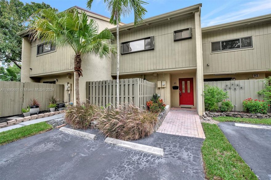 Step inside spacious 2 bed, 2.5 bath, 1,790 SF townhouse in the Middle River community of Fort Lauderdale. The bright foyer leads to dining area with backyard views, while eat-in kitchen features granite countertops, stainless steel appliances, and ample cabinet space with access to the front porch. The first floor includes laundry room and office with extra storage. Upstairs, the master suite offers a walk-in closet, en-suite, and balcony with water views. The outdoor patio is surrounded by lush landscaping. Recent updates include a new roof (2025) with 25-year warranty, new exterior paint (2025), new siding (2025), new balcony (2025), and a 2021 A/C unit. Maintenance covers roof, pest control, lawn, and pool. Close to shopping, dining, beaches, and the airport. Schedule a showing today!