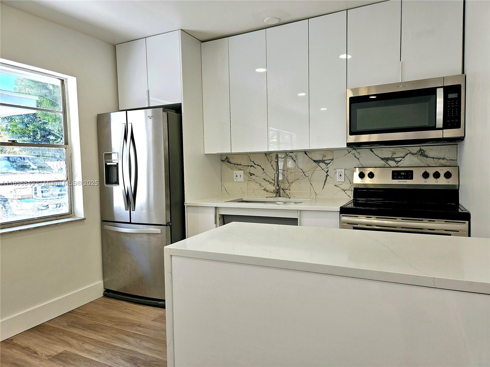 NO HOA, 24 HOUR APPROVAL! Welcome home to this beautiful all renovated unit! This Villa offers a 2 bedroom 1 bath with fresh painted, new bathrooms, new kitchen, new flooring and AC. The gourmet kitchen offers white modern cabinets, SS appliances with quartz countertops, and plenty of space to cook and entertain. A full-size washer and dryer are located in the unit. Enjoy a BBQ in the cute small fenced patio. Conveniently located close to Palm Beach International Airport, I-95, Downtown West Palm Beach, City Place, Clematis, and 8 minutes to Palm Beach Island Beach. Don't miss this hidden gem. Water included.
