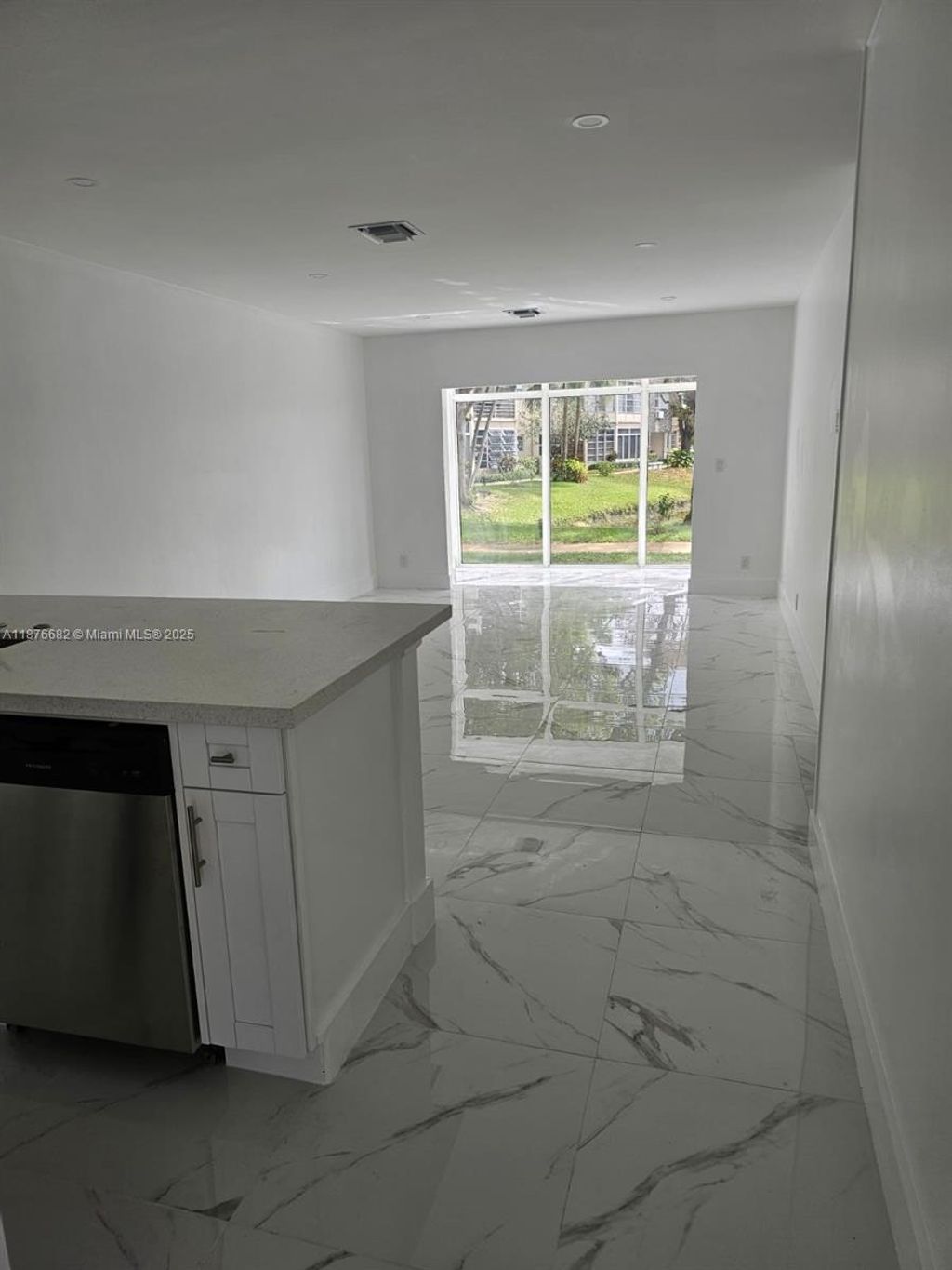 Photo of 3430 NW 52nd Ave #104, Lauderdale Lakes, FL 33319 (MLS # A11876682)