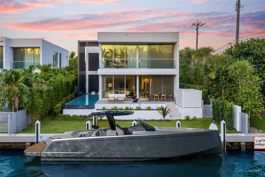 This one-of-a-kind, two-story waterfront villa, designed by Piero Lissoni & Ralph Choeff, combines modern tropical living with The Ritz-Carlton’s exceptional services. The contemporary design includes Georgette Limestone and wood floors, Boffi cabinetry, Gaggenau appliances with a gas range, Ipe hardwood decking, Fantini faucets, and a whole-house gas generator. Situated on Surprise Lake with private dock access to Biscayne Bay, the Intracoastal Waterway, and the Atlantic Ocean, it offers privacy while enjoying world-class amenities and services. Owners also have access to the main condominium building’s amenities and restaurant.