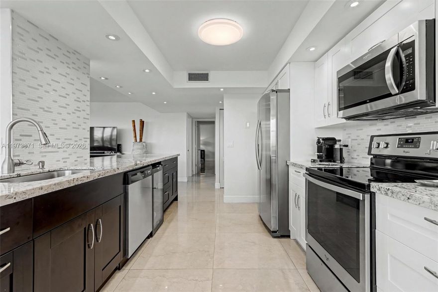 Location, Location, Location, Desirable Guard Gated Complex on Intracoastal side of Ocean Drive with easy Beach Access. Spacious 2/2 + Den with SPECTACULAR WATER VIEWS FROM THE WRAP AROUND TERRACE.....Completely upgraded open kitchen w/granite counters, stainless steel appliances, 30 bottle wine cooler, porcelain tile floors and 2 nicely upgraded bathrooms.  50 year re-certification completed. Complex has been freshly painted, sprinklers installed and interior common areas updated. Low HOA fees for the beach which include wi-fi, water, pest control, heated salt water pool, tennis, state of the art fitness center & management  on site.   Located just 20 minutes south of Ft. Lauderdale Airport. Close to Gulfstream Race Track & Casino & Aventura Mall. Convenient to shopping & transportation.  Seller to pay all assessments at closing.  Firpta Required. Easy to show call LA.