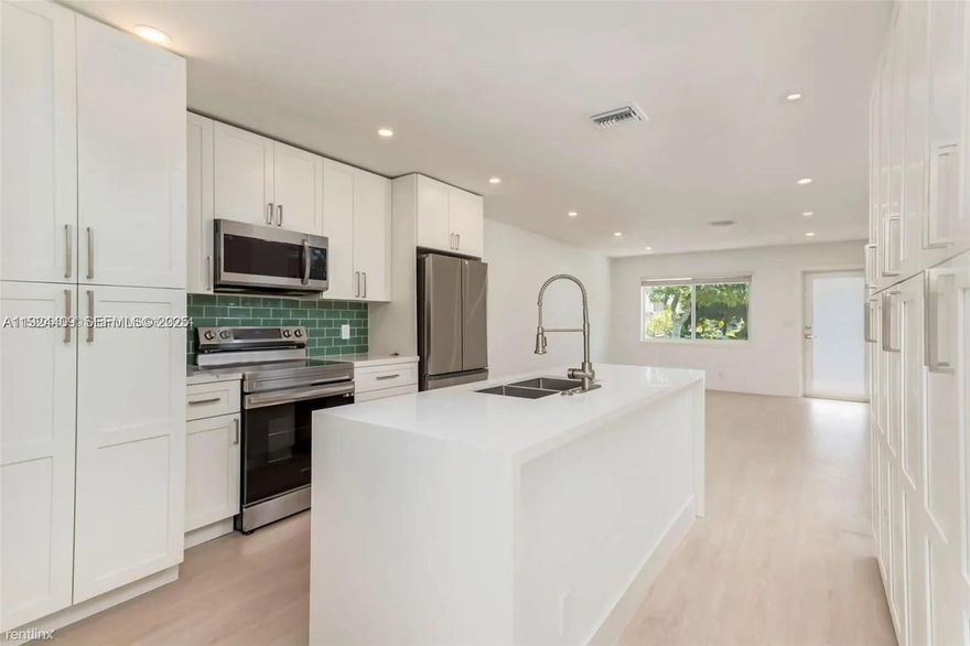 Stunning and modern 2-bedroom, 2-bath home centrally located just minutes from the beach! Rent includes water, landscaping, and pest control. Light-filled and spacious, this home features an open floor plan with designer finishes, a modern kitchen with shaker cabinetry, stainless steel appliances, quartz countertops, and an in-unit washer and dryer. Generously sized bedrooms and a private, expansive backyard make this home perfect for enjoying the South Florida lifestyle. Located in a quiet, residential neighborhood with a large driveway and plenty of parking. Close to shopping, dining, entertainment, and more. Don’t miss out—this one will go fast!