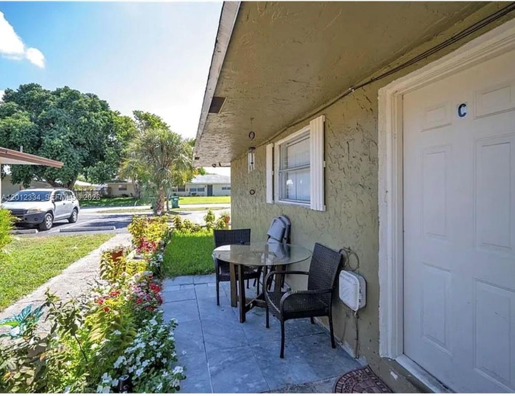 Photo of 581 Kathy Ln #D, Margate, FL 33068 (MLS # A12012334)