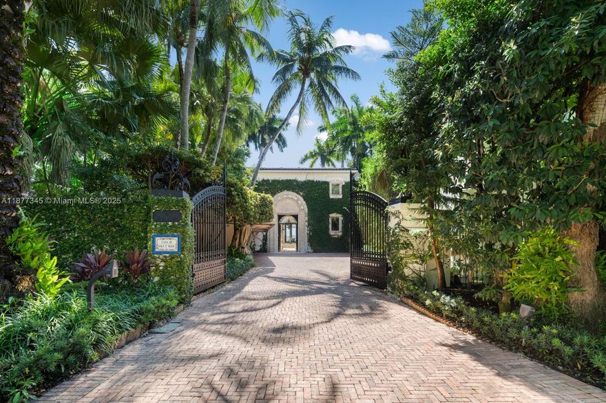 Step Inside With Me! This Mediterranean Revival showcases enchanting interiors, exceptional craftsmanship, and open bay views. The Main House underwent a 2025 renovation featuring double-height ceilings in social areas, sun-drenched living spaces with arched windows, a TV lounge, custom bar, wine cellar, elevator & private office. The contemporary kitchen offers custom millwork, generous island & a breakfast nook. The primary wing exudes elegance with dual dressing rooms, a spa-like bath and panoramic views. A stunning pool + spa, dual cabanas, grill, dock and 115' of water complete the outdoors. A separate ivy-draped guest house and idyllic courtyard entrance set the tone for timeless character with modern comfort. Set on over 17,500 SF of land with gated private driveway & ample carport.