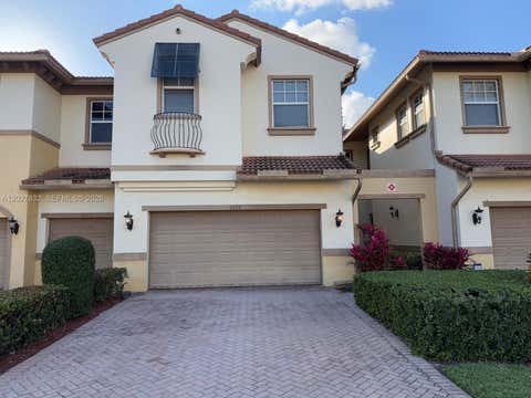 Photo of 6024 NW 118th Dr, Coral Springs, FL 33076 (MLS # A12027832)