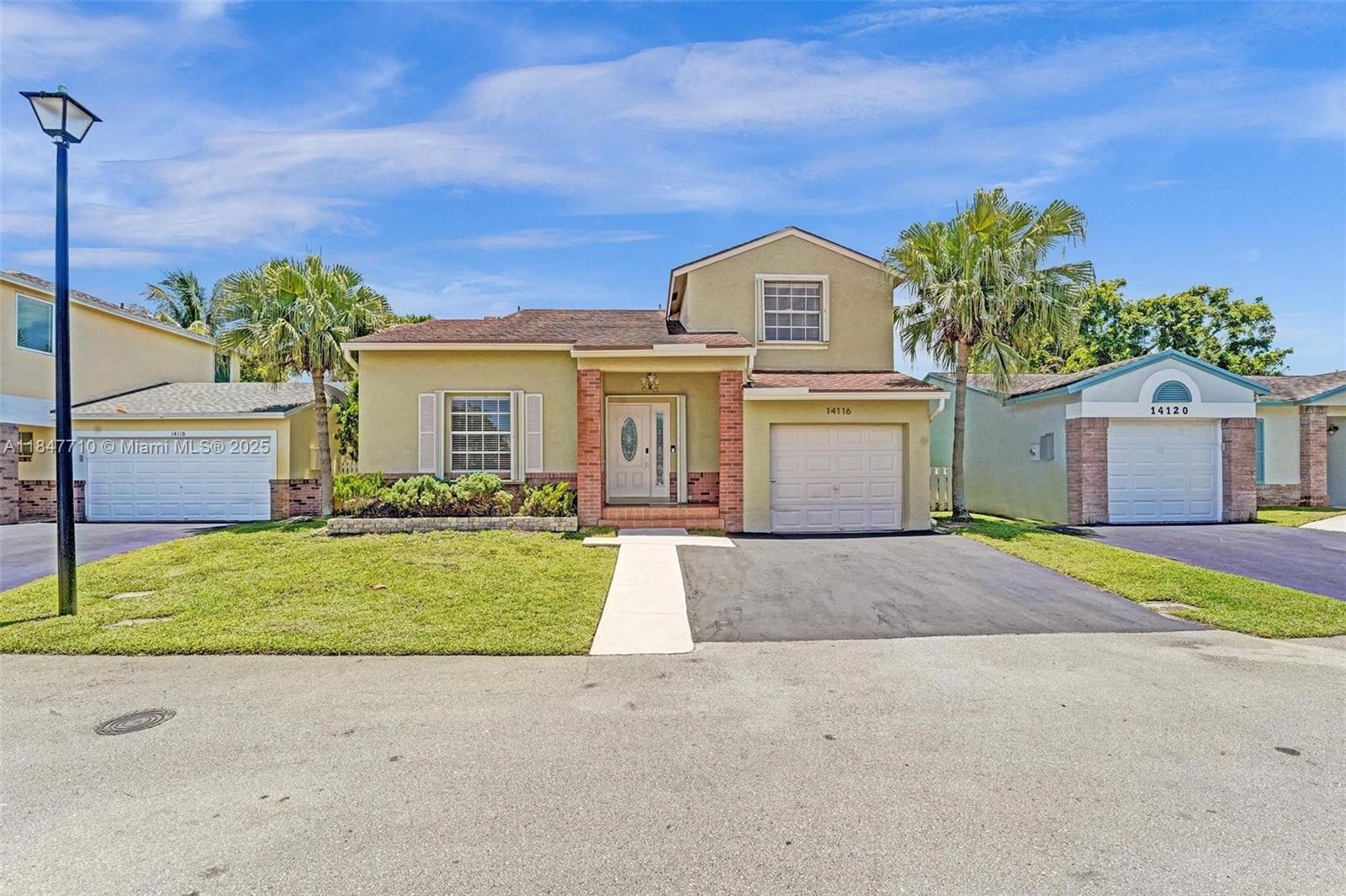 This delightful 3-bedroom, 2.5-bath home is tucked away in a peaceful cul-de-sac on a generous lot, offering abundant natural light and vaulted ceilings. The main living areas feature tile and laminate flooring, while the newly updated bathrooms add a fresh touch. Enjoy extra storage or office space, and step outside to a fenced yard with your very own mango & banana fruit-bearing trees! Accordion shutters throughout provide extra peace of mind. Additional perks include fresh paint inside and out, ceiling fans, and custom closet shelving. Located in beautiful Shenandoah, with top-rated schools, easy access to highways, shopping, dining, the airport, and Sawgrass Mills Mall. Low HOA with access to a community pool, parks, trails, tennis, and basketball courts. Come see for yourself!