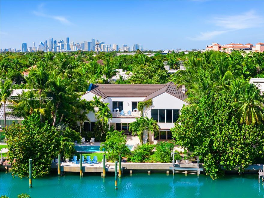 A BOATERS PARADISE WITH SERENE WATER & PROTECTED LUSH GREEN TROPICAL RESERVE VIEWS FROM THIS NEW IMPECCABLE TRANSITIONAL KEY BISCAYNE WATERFRONT ESTATE! Lush Pathway leads to Loggia Entrance. Home encompasses 6 Beds + 6 Baths + 2 Powder in 8,473 Adj SF of Interiors 18,600 SF Lot w/100 FT of Waterfrontage. Concrete Seawall & Dock + Boat Lift w/15,000 LBS Capacity. Open Living Area w/Soaring Ceilings + Terrace. Saltwater Heated Pool w/Views of Pines Canal & Bill Baggs Park. ItalKraft Kitchen w/Miele & Sub Zero Appliances + Wine Storage + Catering & Summer Kitchen. Primary Suite w/Gym, Two Closets + Spa Bath. Marble & Porcelain floors. Control4 Home w/Electric Shades. 2 Laundry Rooms. Garage w/Golf Cart Space. Central Vacuum System, 110K Generator, Automatized Terrace Screens & Elevator Ready