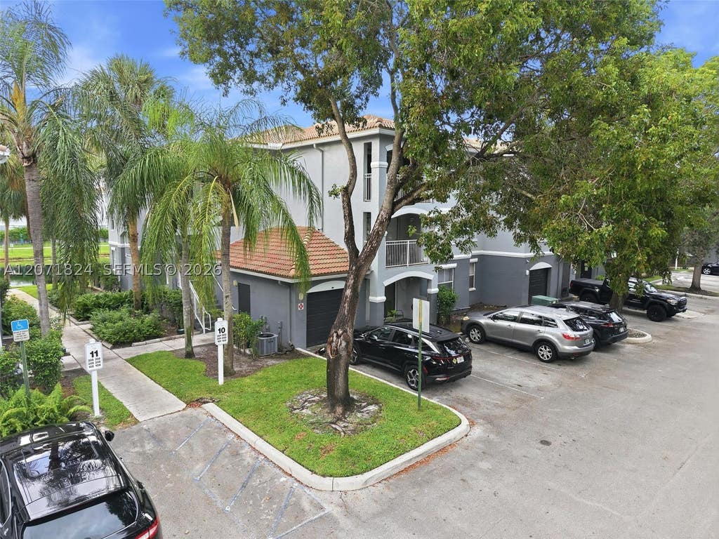 Photo of 9615 NW 1st Ct #302, Pembroke Pines, FL 33024 (MLS # A12071824)