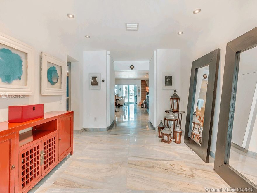 $750K Below Appraised Value! ! ! Renovated in 2014 Zen Bayfront home in a premier wide Bay location on 24 hr. guard gated Palm Island. New dock & salt water pool, move-in condition. Seller willing to negotiate all offers!