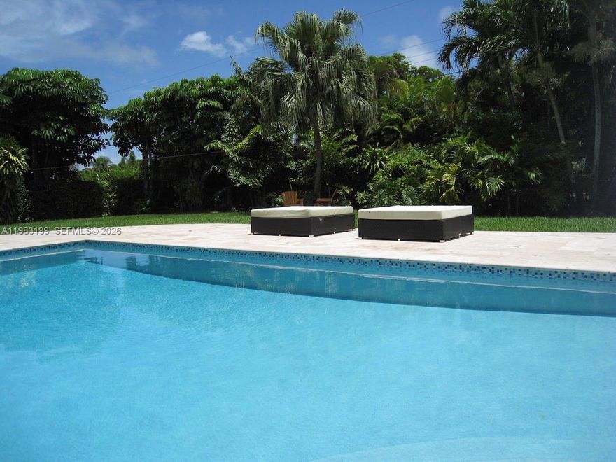 Beautifully updated family home on a quiet street and walking distance to top public schools. Chef's kitchen with gas range. Marble floors throughout with impact windows and doors bringing in plenty of light. Covered patio with stone pool deck and private landscaped backyard. Large family room with built-ins, plenty of closets and indoor laundry. Gated driveway with pavers and a brand new roof. Per appraiser's report, square footage is as follows: living = 3,063, adjusted = 3,275, total = 3,700.