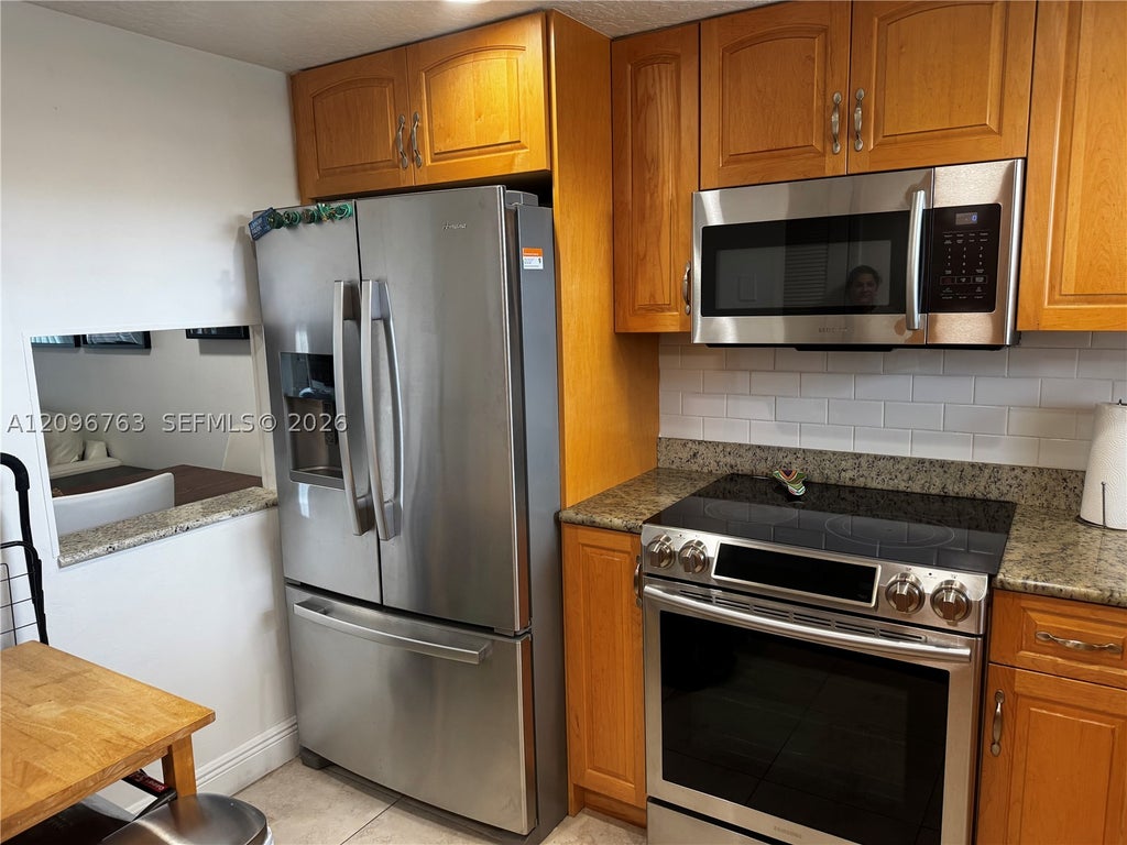 Photo of 8435 Sunrise Lakes Blvd #211, Sunrise, FL 33322 (MLS # A12096763)