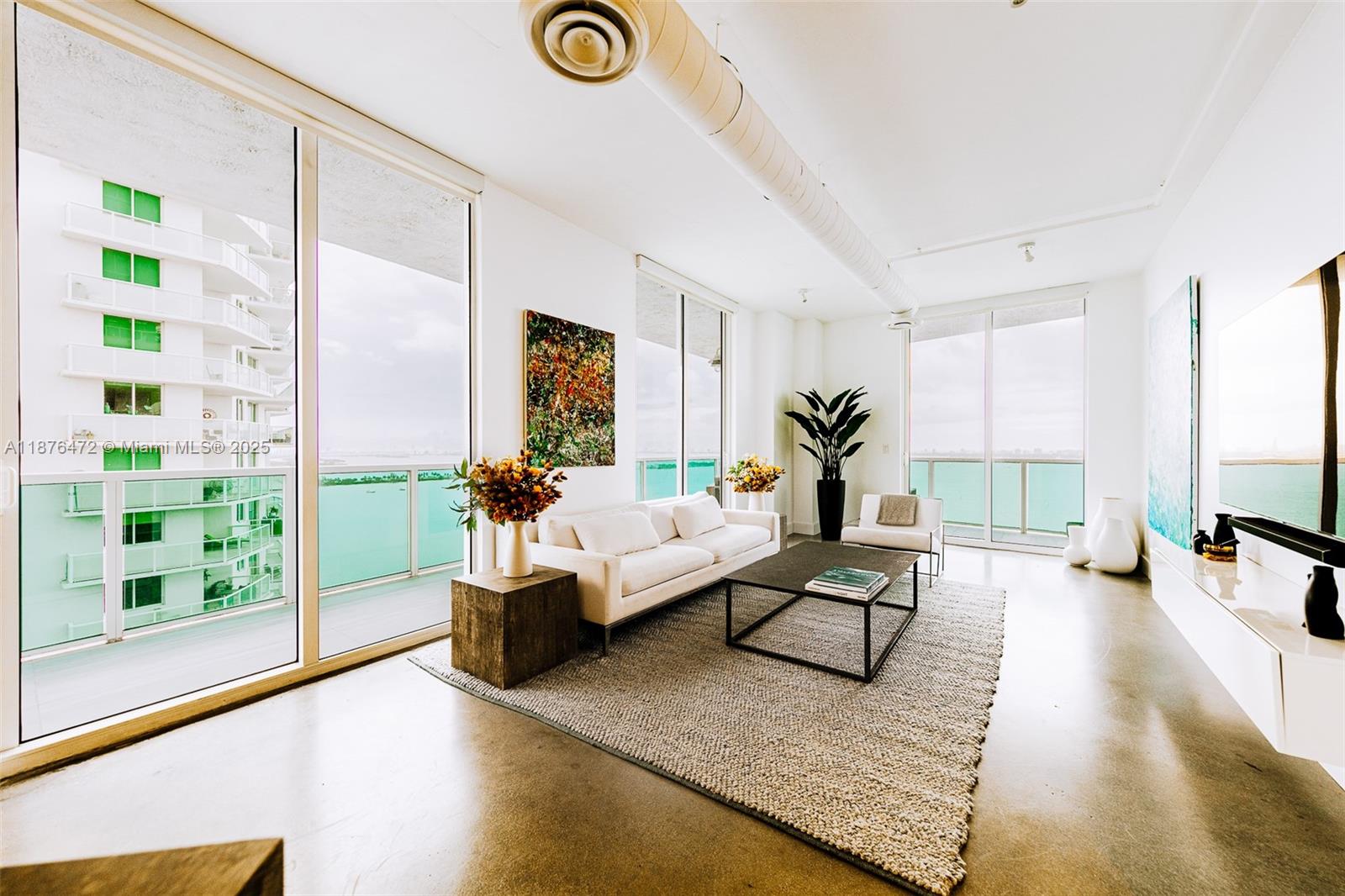 Discover the exquisite Star Lofts Residence 2003, nestled in the vibrant Edgewater neighborhood of Miami. Step onto the impressive wrap-around balcony where nearly 1k SqFt of unobstructed panoramic views of the Biscayne Bay, Atlantic Ocean, and the Miami skyline. Inside, you’ll find a spacious and inviting open floor plan, an oversized kitchen and an expansive main bedroom suite. Its loft-styled design boasts 10-foot ceilings, exposed AC ducts & conduits. Star Lofts is a charming boutique building w/only three units per floor, It is also exceptionally pet-friendly, complete with its very own dog park on the 7th floor. Other amenities that Star Lofts has to offer, including a newly renovated infinity-edge pool, an elegant lobby, a fully equipped gym, and convenient storage and bike rooms