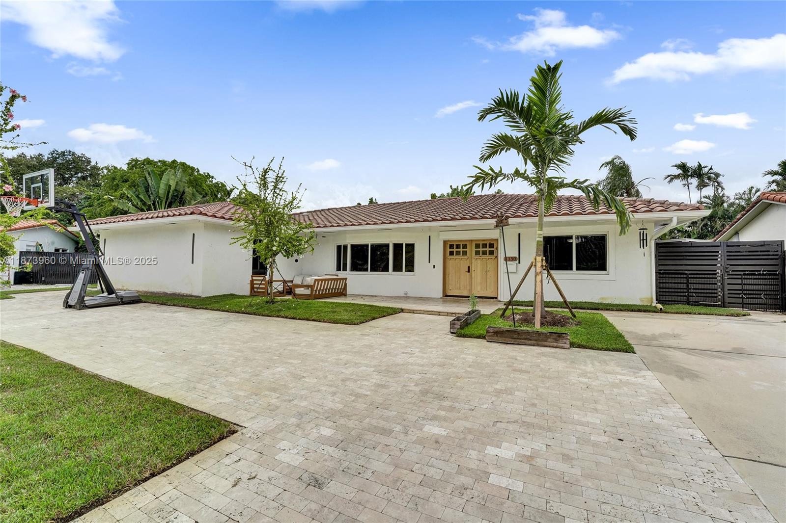 Beautifully updated 6BR/3BA home on a 13,000 sq. ft. lot with 3,400 sq. ft. of living space. Features include tile & 8’ European plank flooring, wind impact windows & sliding doors, solid wood wind-impact entry door, new iron gates, new wood fencing, renovated bathrooms with jetted tub, fresh paint, and recent A/C & 80-gallon water heater. Gourmet kitchen offers a large island, stainless steel appliances, and open layout to living/dining rooms. Outdoor oasis includes heated saltwater pool with new pump, outdoor kitchen, pergola with lights/fans, French-pattern pavers, mature trees, lush landscaping, and a Spalding glass basketball hoop. Prime location near Hard Rock Casino, highways, houses of worship, shopping, dining, and beaches. Don't miss this dream home opportunity!