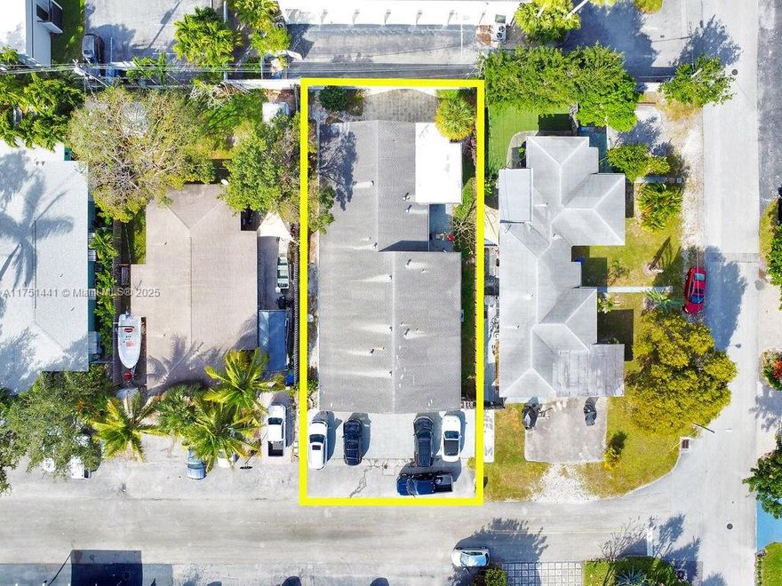 This beautifully renovated and modern investment property offers exceptional value with a legal duplex and an additional efficiency unit, plus an oversized garage! Each unit features 2 spacious bedrooms, 2 well-appointed bathrooms, a separate living room, and a kitchen that opens into a large family room, providing an open and inviting layout. Both units include their own laundry rooms and central A/C systems for added convenience and comfort. The property is equipped with two separate water meters and two FPL meters. The roof was replaced in December 2000, offering plenty of remaining life. The efficiency unit shares meters a with 1719. Just steps from many shops, parks, and restaurants, offering an unbeatable location for both tenants and investors alike.