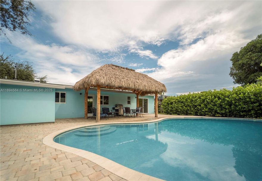 Paradise near the beach is calling your name! This stunning 3/2 completely renovated and fully furnished home with new roof and impact glass is ready for you to call it home or start your short-term rental business. No association approval required or hassle. Home offers screened in front porch, fenced in back yard, pet friendly, saltwater pool, and Tiki Hut for entertaining. Only 1 Mile to the famous Deerfield Beach, Fishing pier, shops, and restaurants. Walk across the street to Starbucks, Publix, and Restaurants. What more can you ask for this home will not last! All furniture is included on the sale